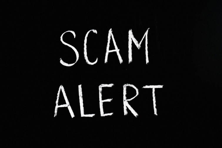 Scam alert, in black and white